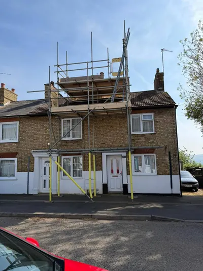 Scaffolding with safety netting and guardrails
